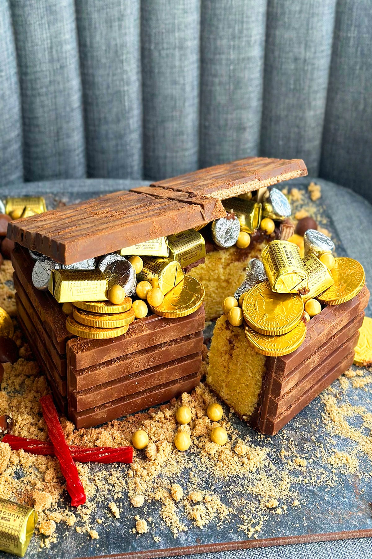 Sliced Pirate Treasure Box Cake Filled With Gold and Silver Candies 