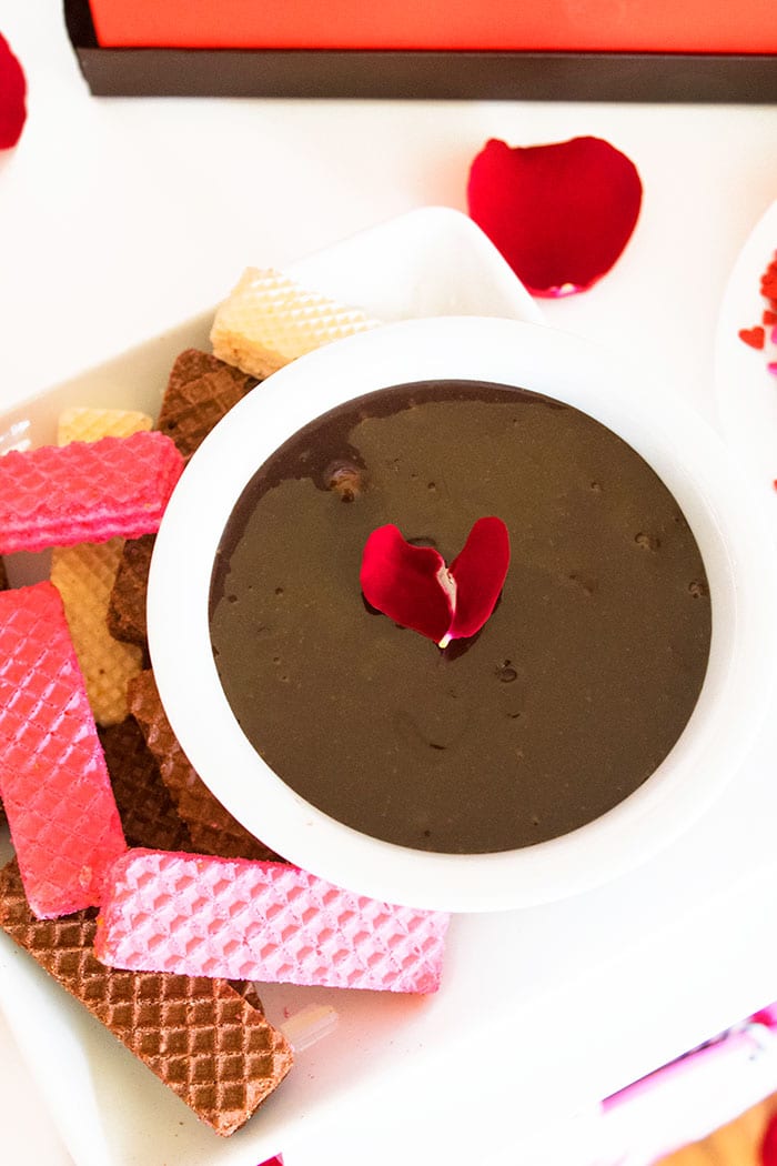 Chocolate Dip in White Bowl With Rose Petals and Wafers