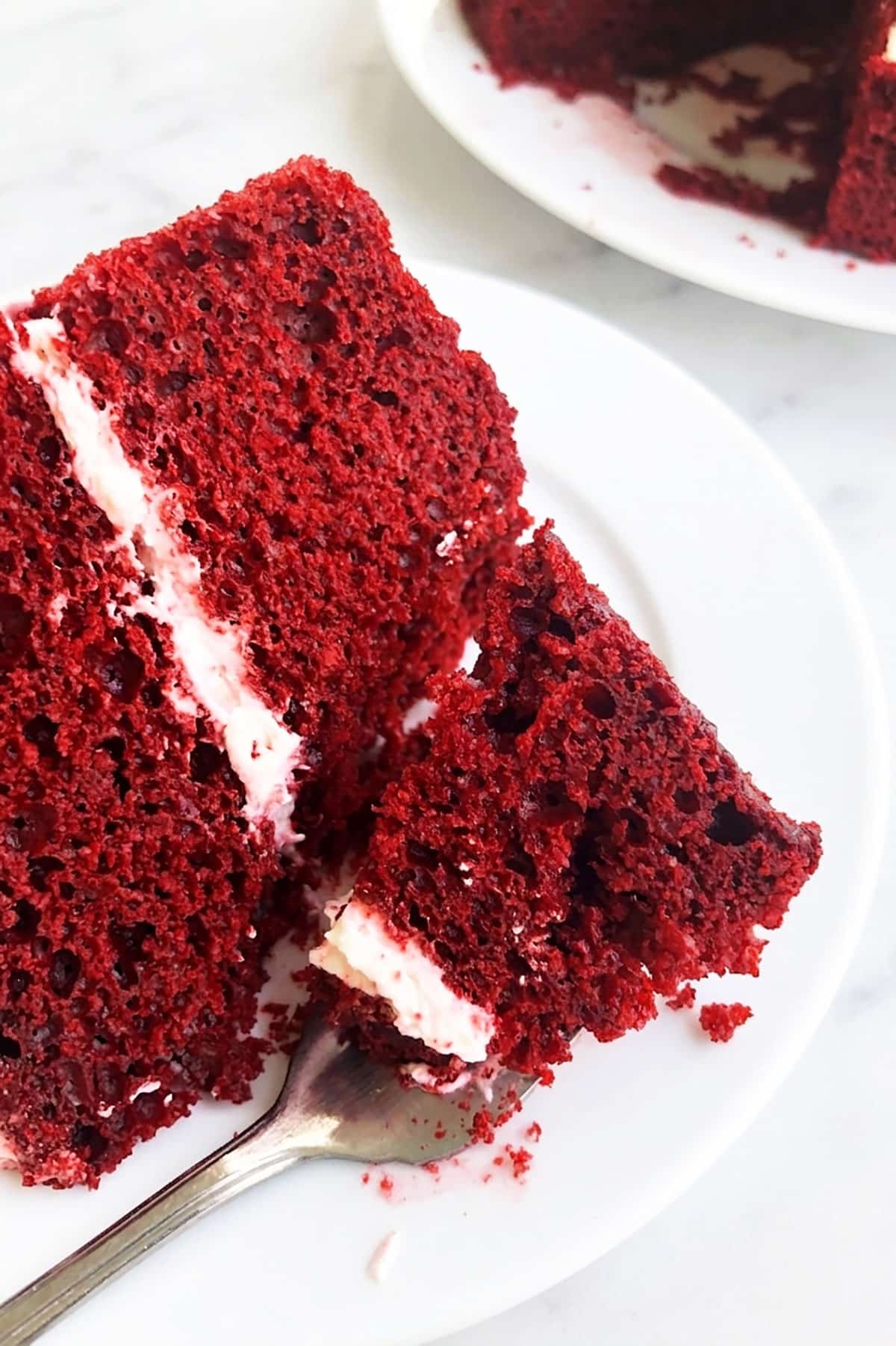 Spoonful of Cake on White Dish. 