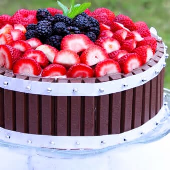 Easy Kit Kat Cake With Strawberries on Glass Cake Stand With Nature Background