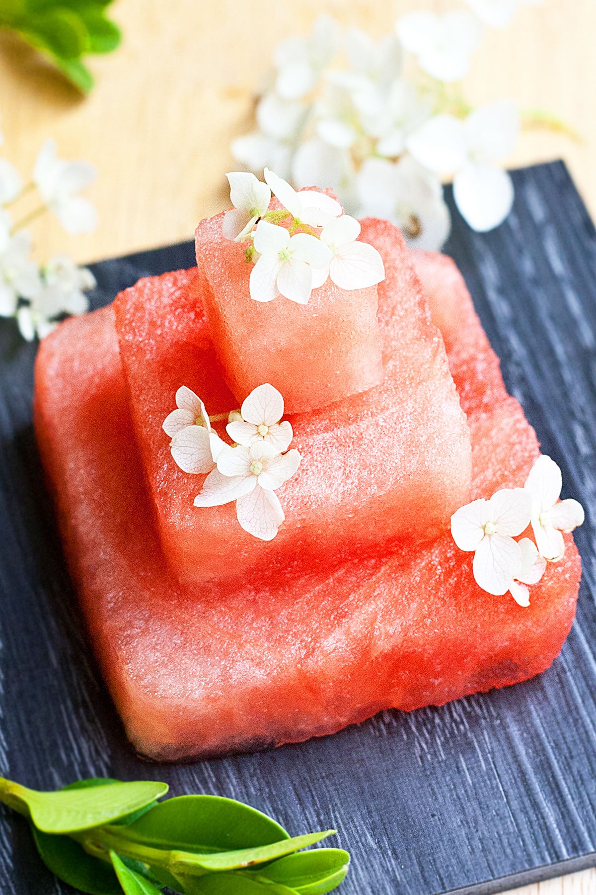 Easy Fresh Watermelon Cake With Fresh Flowers on Black Serving Dish 