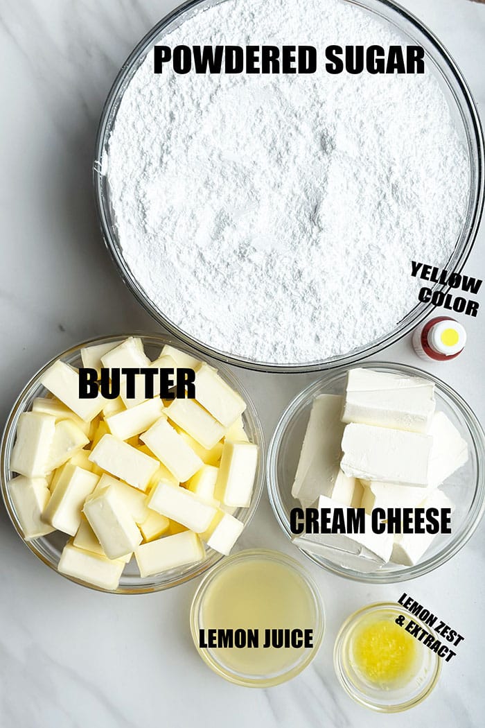 Ingredients For Lemon Icing in Glass Bowls on Marble Background