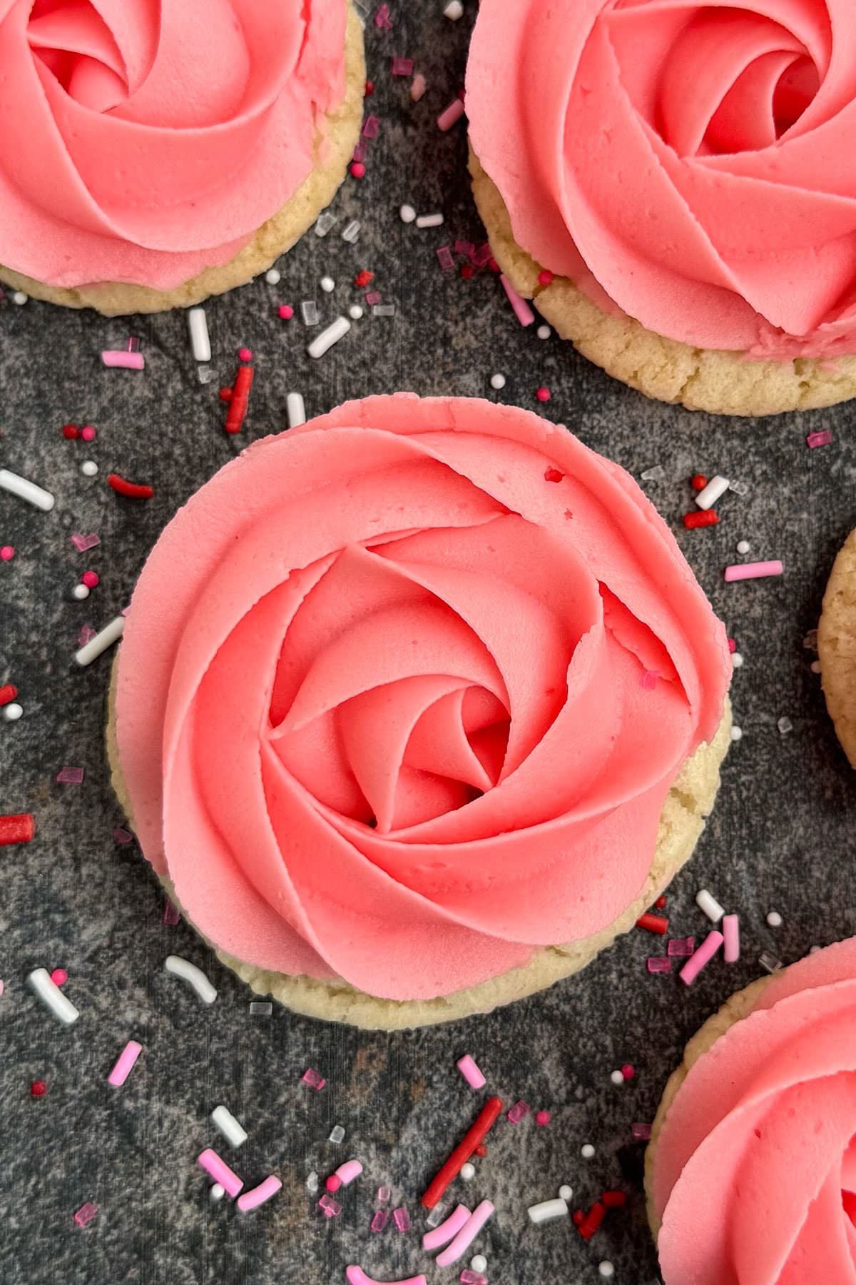 Closeup shot of frosted cookies on rustic gray background. 
