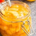 Easy Homemade Apple Pie Filling in Glass Jar on Rustic Gray Background.
