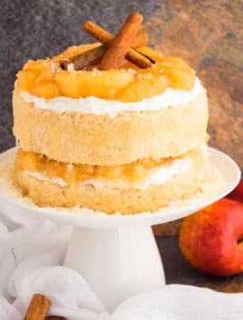 Easy Apple Pie Cake With Pie Filling and Buttercream Frosting on White Cake Stand