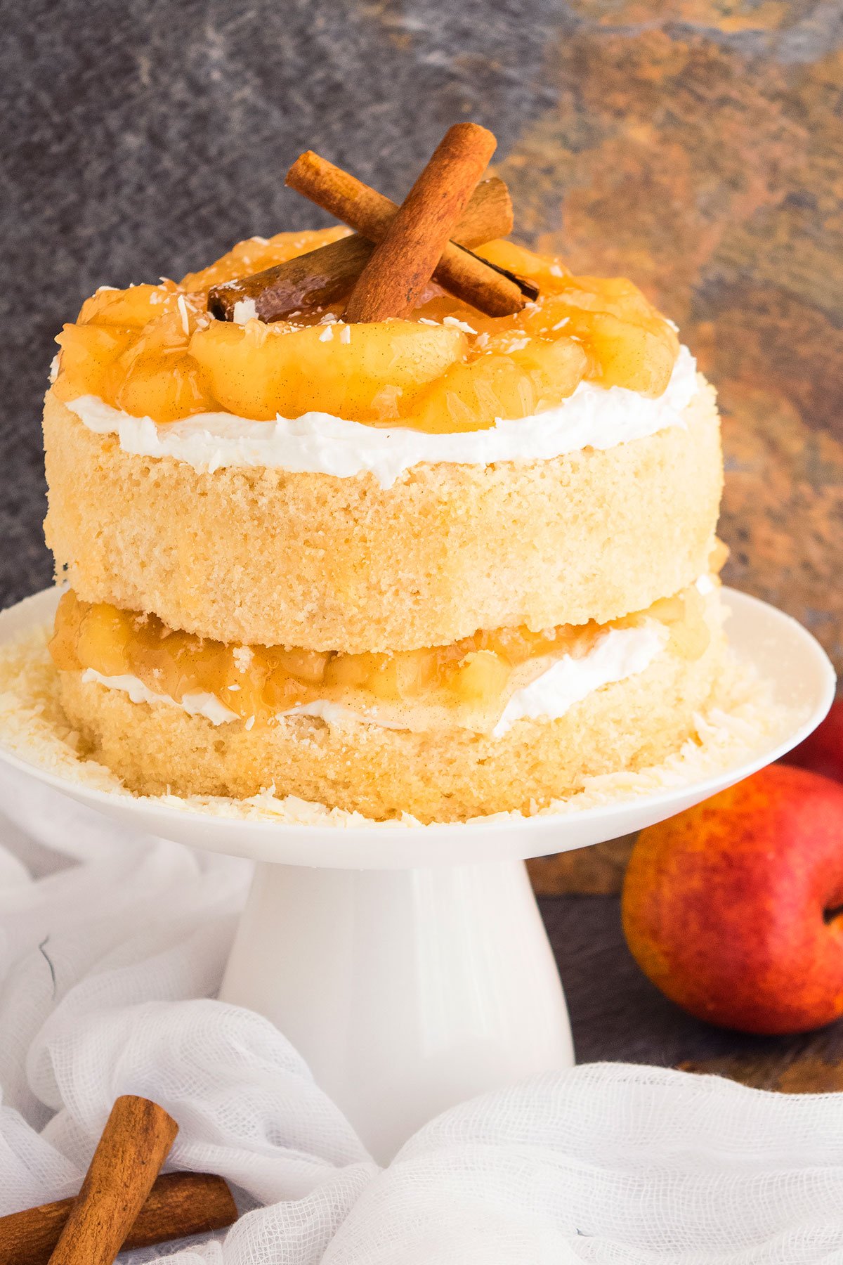 Easy Apple Pie Cake With Pie Filling and Buttercream Frosting on White Cake Stand