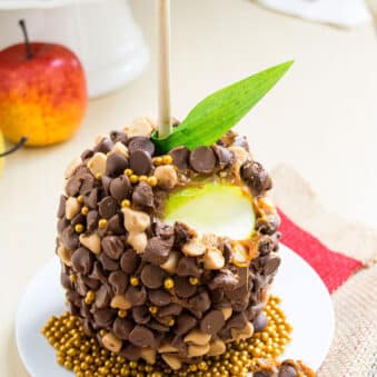 Easy Homemade Chocolate Caramel Apples on White Dish- Partially Eaten