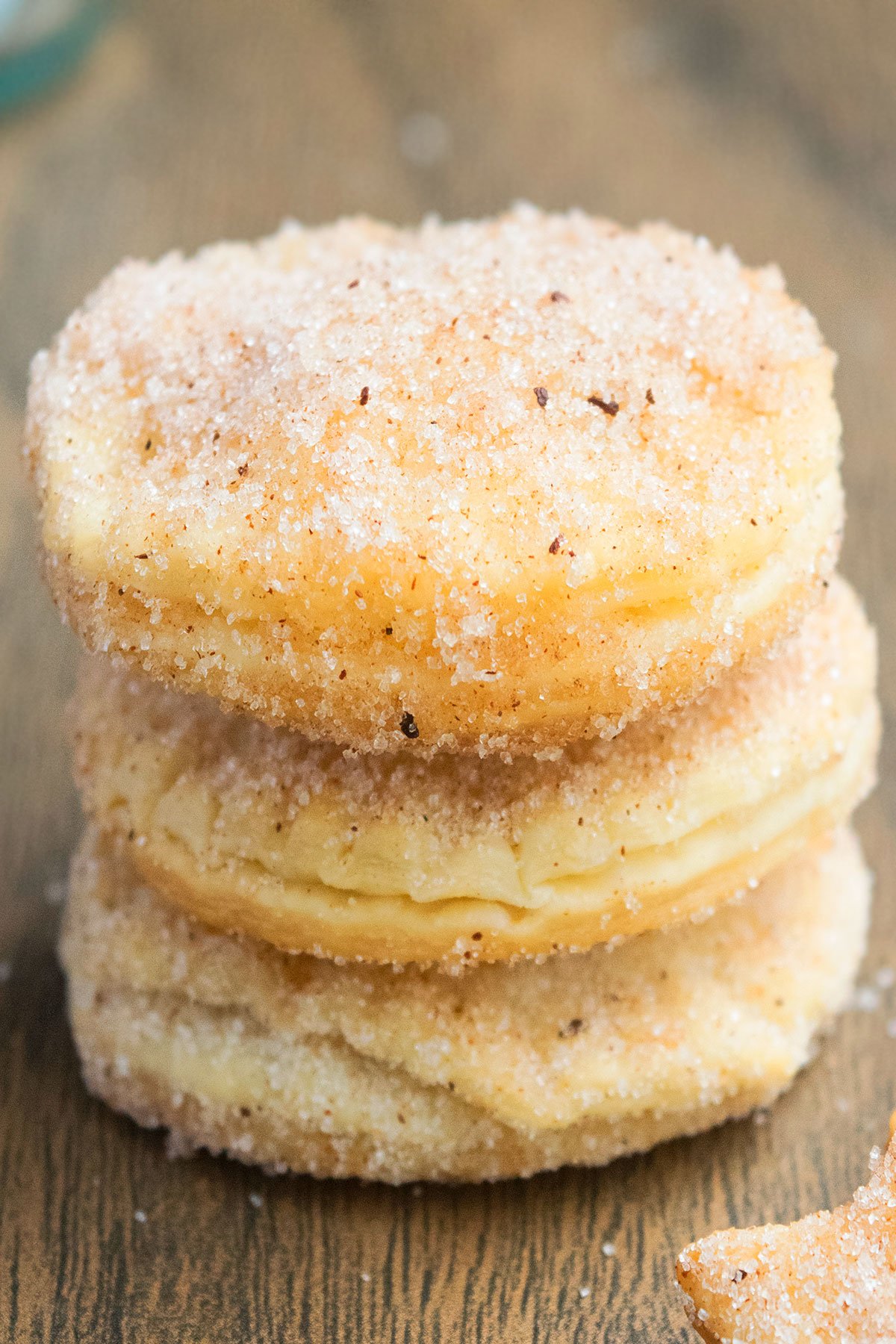Stack of Easy Churro Cookies With Pie Crust on Rustic Wood Background