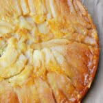 Easy Upside Down Pear Cake on Rustic Brown Background- Overhead Shot