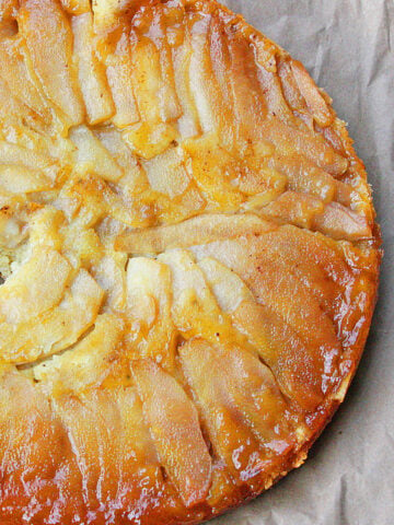 Easy Upside Down Pear Cake on Rustic Brown Background- Overhead Shot