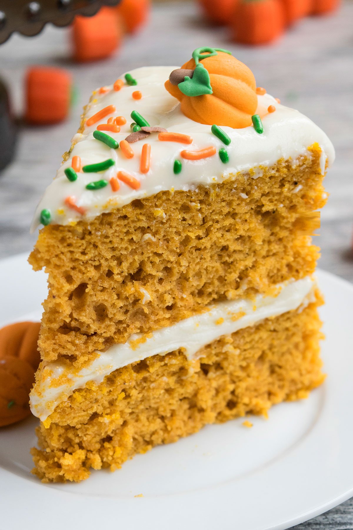 Slice of Easy Pumpkin Cake With Cake Mix Box and Cream Cheese Frosting.