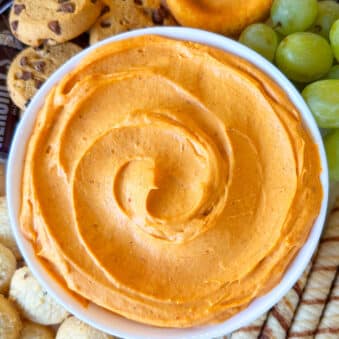 Easy Pumpkin Dip in White Bowl on Tray With Cookies.