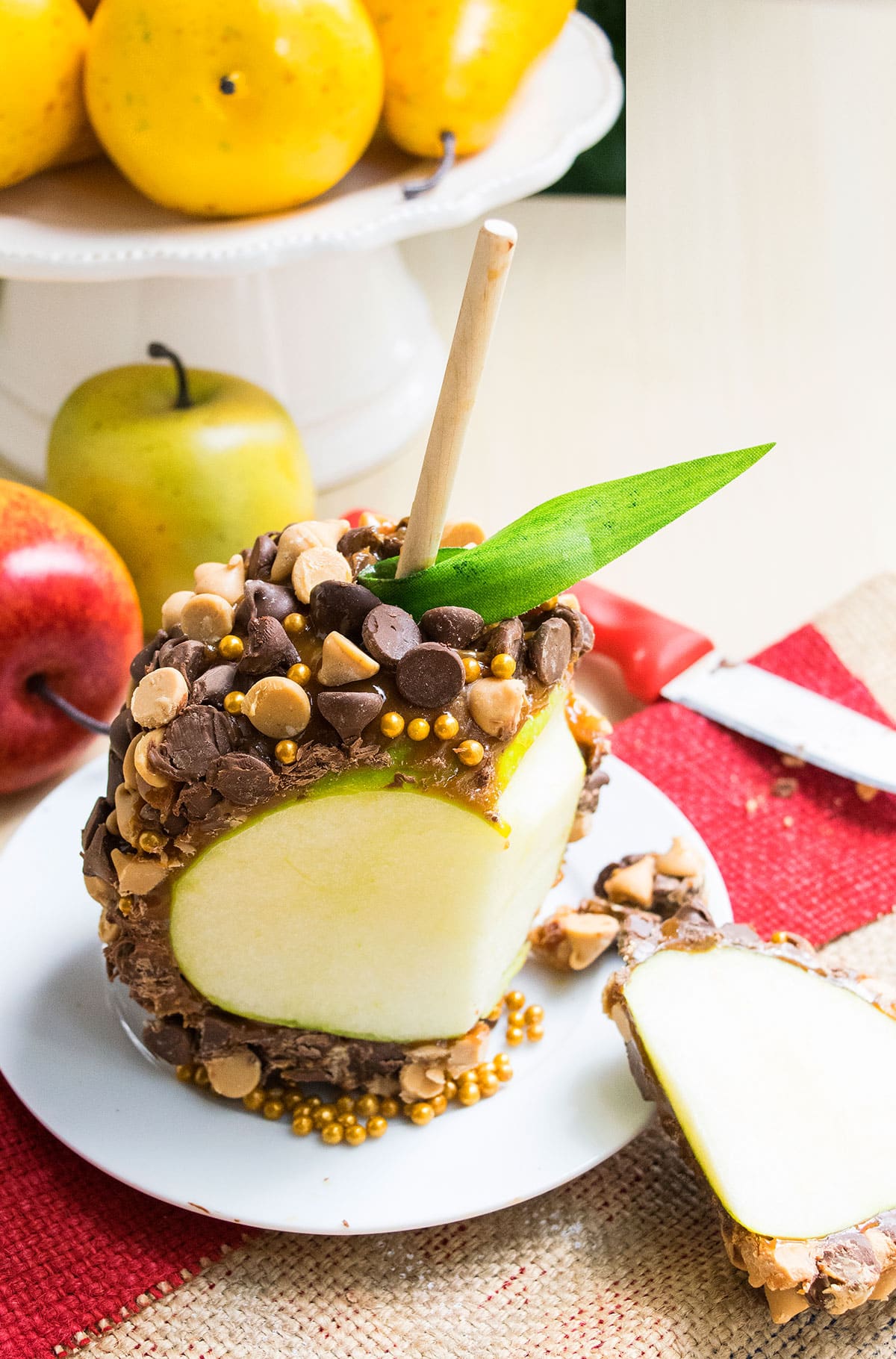 Sliced Chocolate Apples on White Dish.