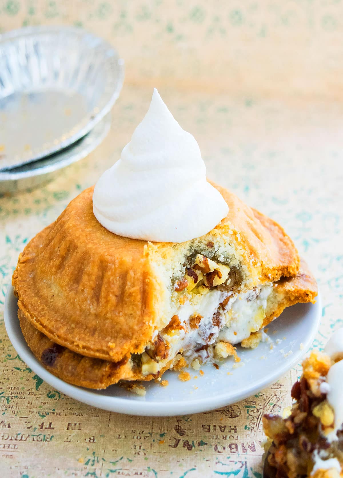 Mini Pie Sandwich With Whipped Cream on White Plate