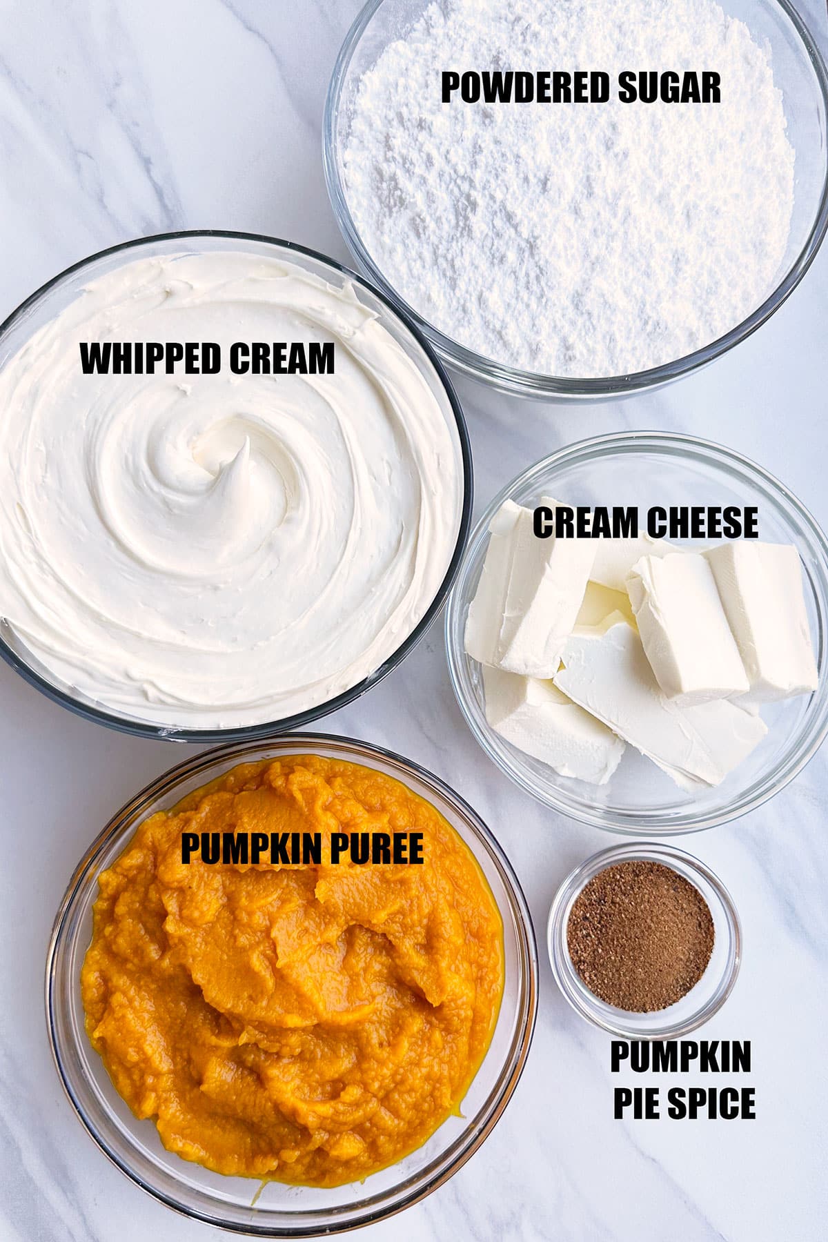 Ingredients in Bowls For Sweet Dip on White Marble Background. 