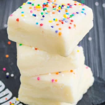 Stack of Easy White Chocolate Fudge From Scratch (2 ingredients) on Gray Background.