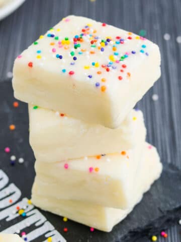 Stack of Easy White Chocolate Fudge From Scratch (2 ingredients) on Gray Background.