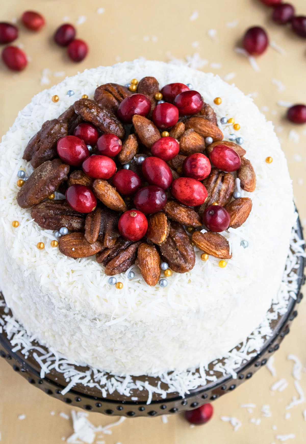 Closeup Shot of Fresh Cranberries and Candied Nuts Decoration on Top of Cake. 