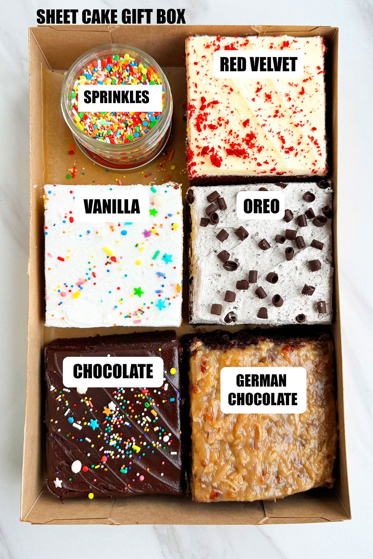 Homemade Sheet Cake Gift Box on White Marble Background- 5 Flavors. 