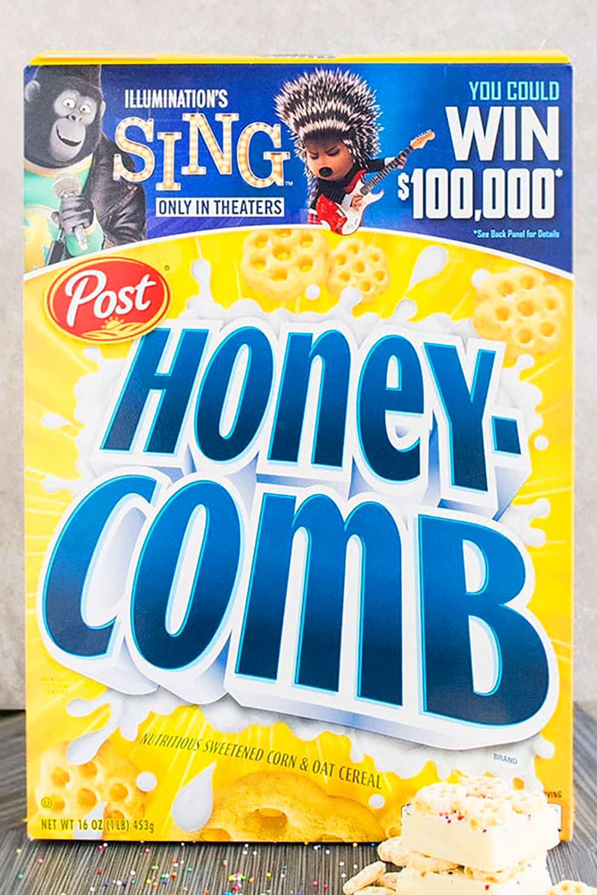 Box of Honeycomb Cereal on Dull Gray Background. 