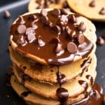 Stack of Easy Coffee Pancakes With Mocha Sauce/ Syrup and Chocolate Chips on Black Pan.