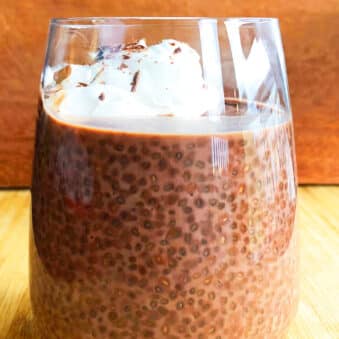 Easy Chocolate Chia Seed Pudding With Whipped Cream in Glass Cup.