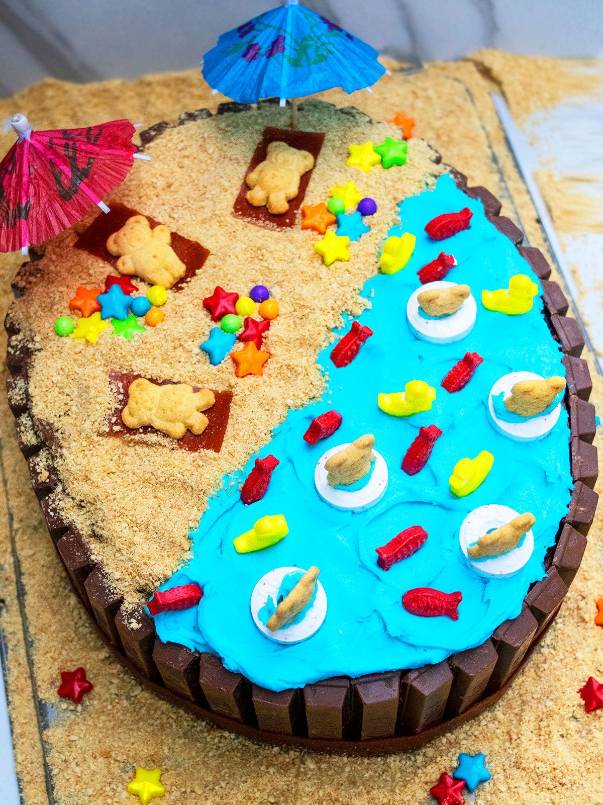 Easy Summer Cake (Beach Cake) With Kit Kat on Marble Background.