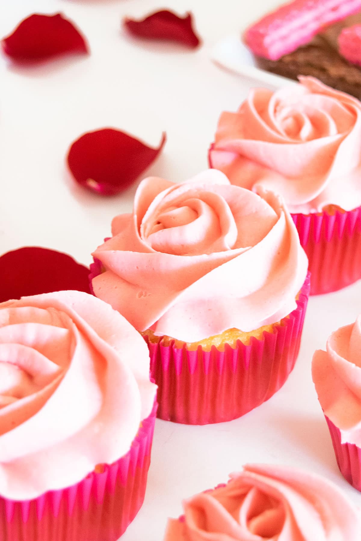 Pink Rose Cupcakes on White Table.