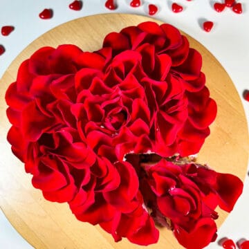 Easy Red Rose Cake With Fresh Flower Petals on Wood Cake Stand.