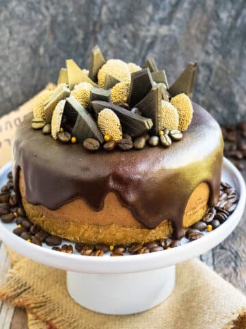 Easy Coffee Cheesecake With Ganache (No Bake) on White Cake Stand.