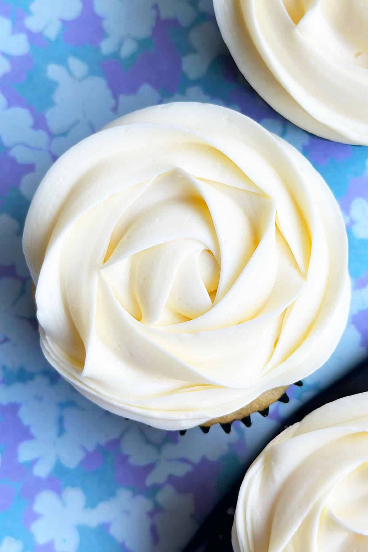 Best Homemade Almond Icing Piped on Top of Cupcake. 