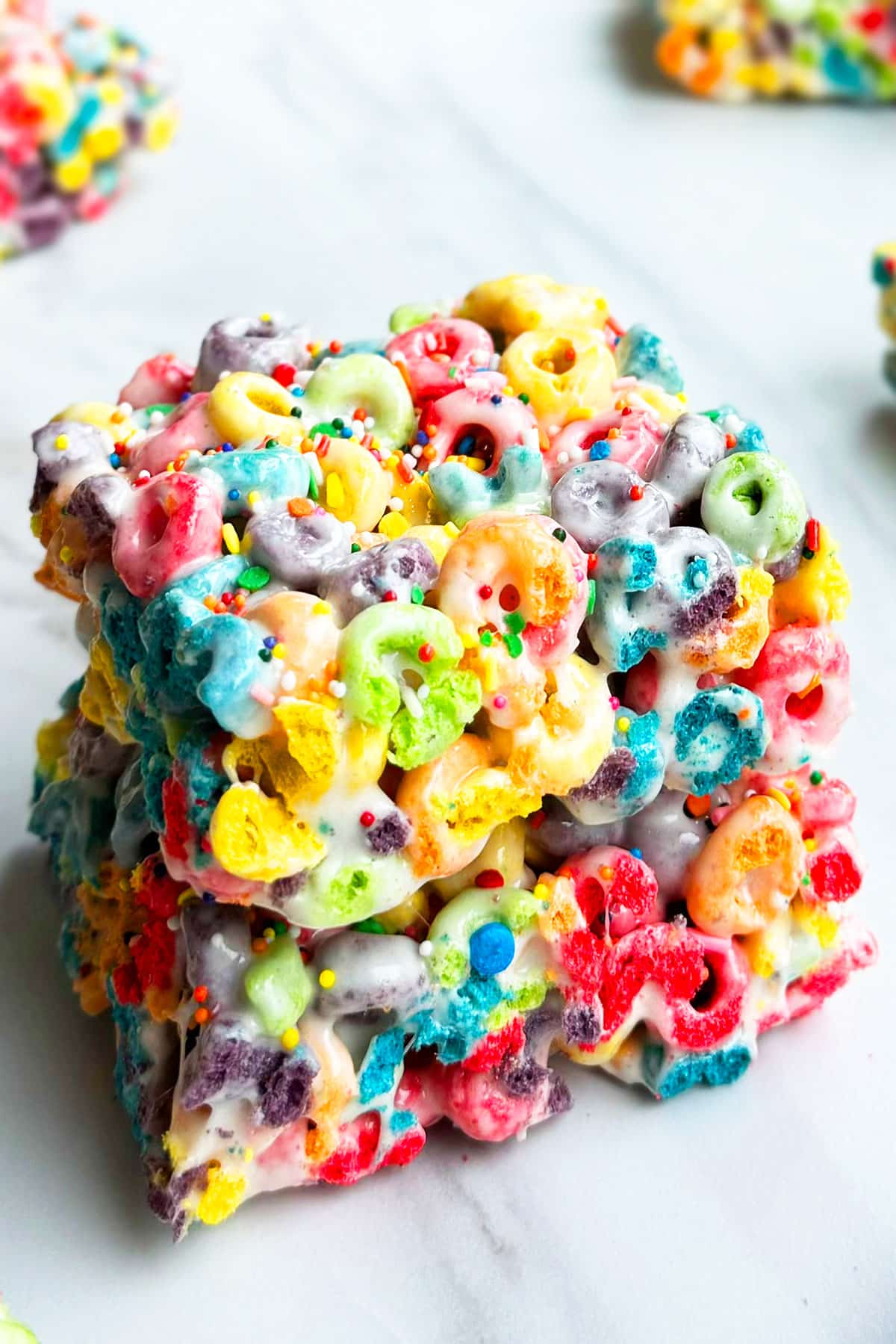 Stack of Easy Cereal Bars With Rainbow Froot Loops. 