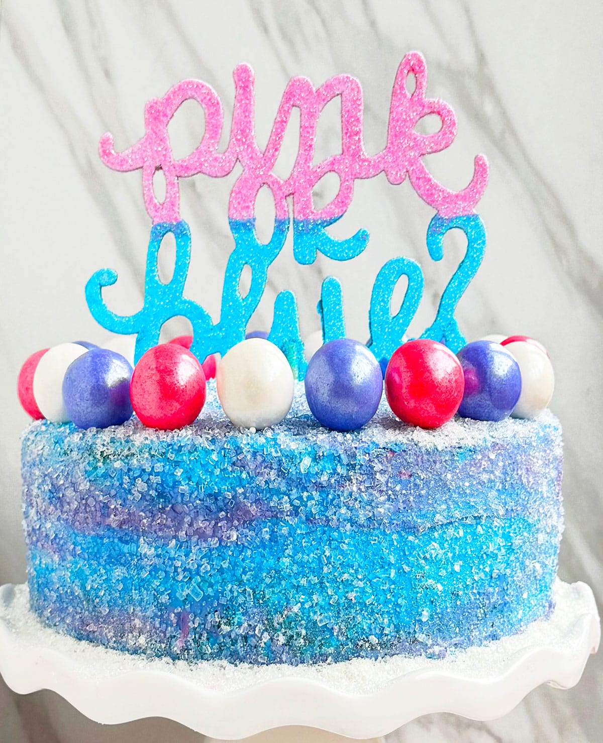 Easy Homemade Gender Reveal Cake With Pink and Blue Buttercream Icing on White Dish. 