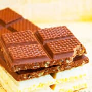 Stack of Easy Chocolate Crunch Bars on Sheet of Newspaper.