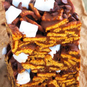 Stack of Easy No Bake Smores Bars on Brown Parchment Paper.