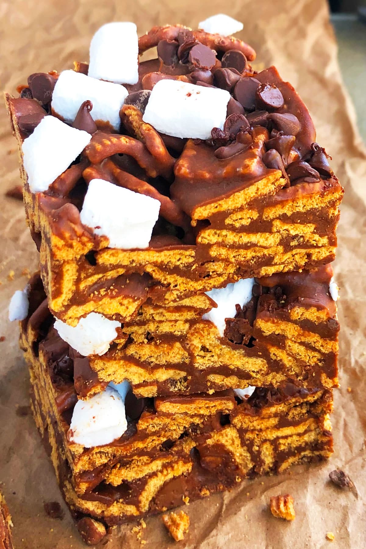 Stack of Easy No Bake Smores Bars on Brown Parchment Paper.