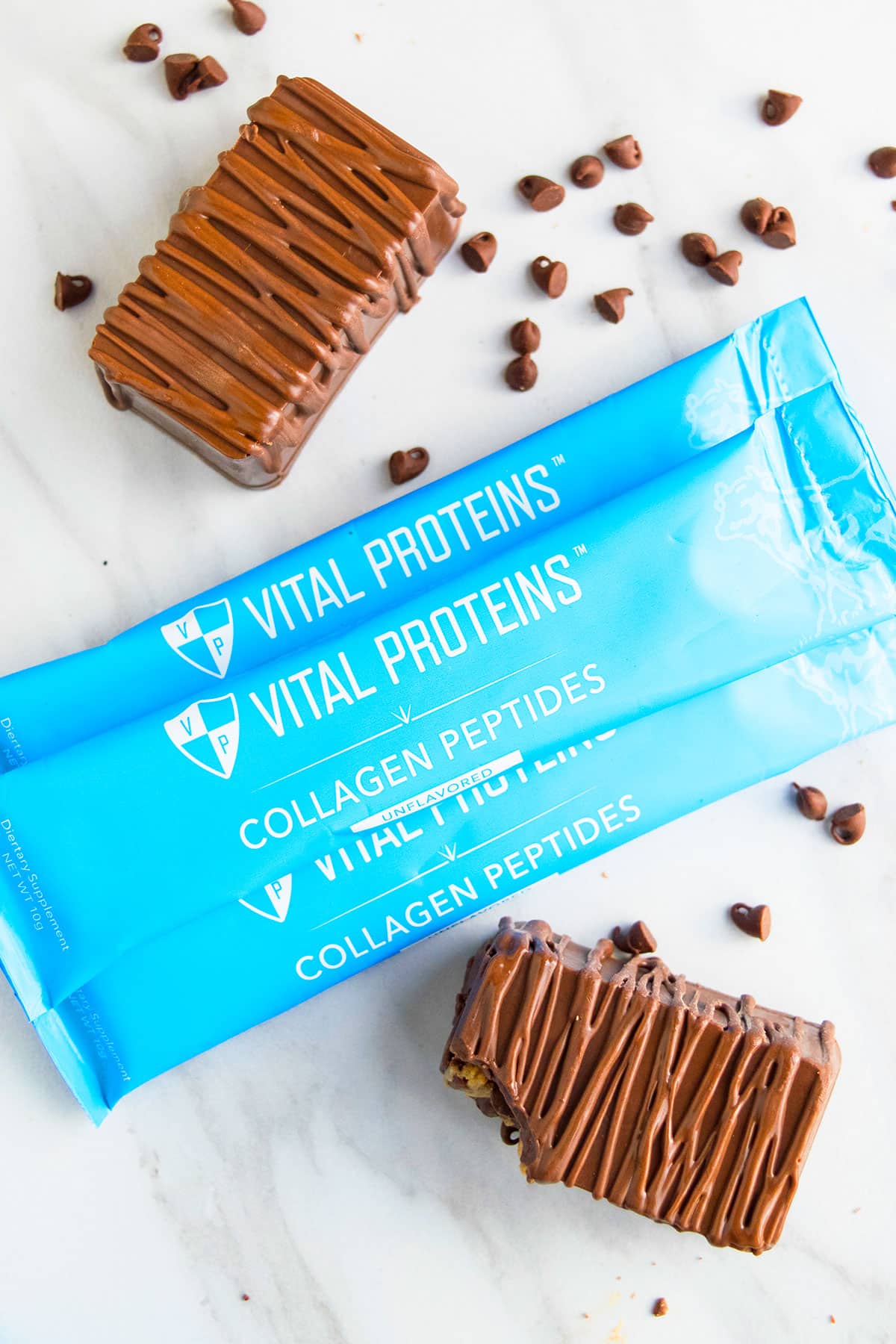 Blue Packets of Vital Proteins Collagen Peptides on White Marble Background. 