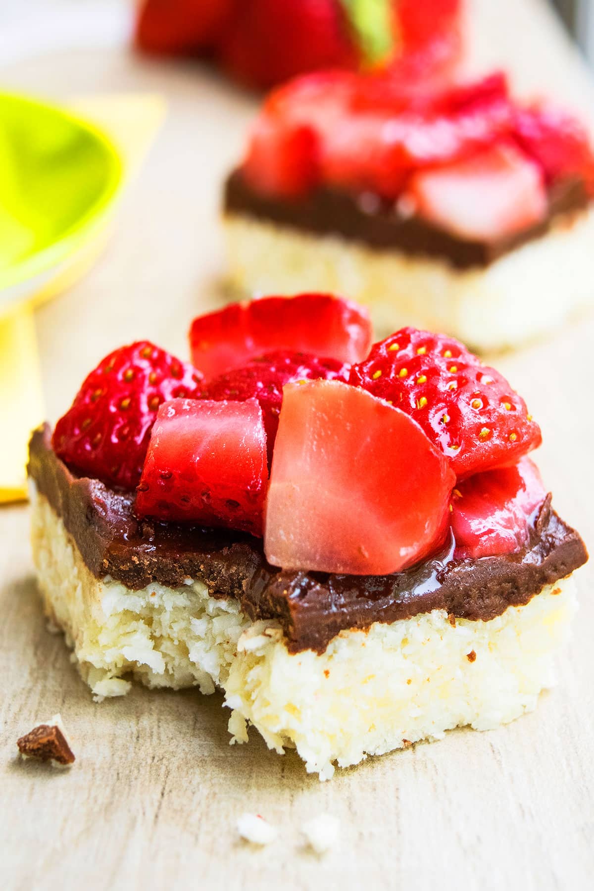 Partially Eaten Macaroon Bars With Chocolate and Strawberries.