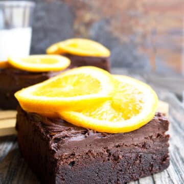 Slice of Chocolate Orange Brownies With Chocolate Buttercream Frosting and Fresh Orange Slices.