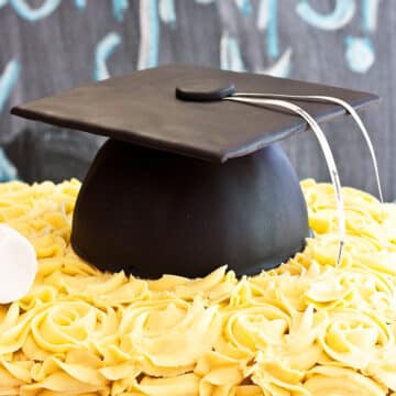 Easy Graduation Cake (Cap) Decorated With Fondant and Buttercream Frosting on Chalkboard Background.
