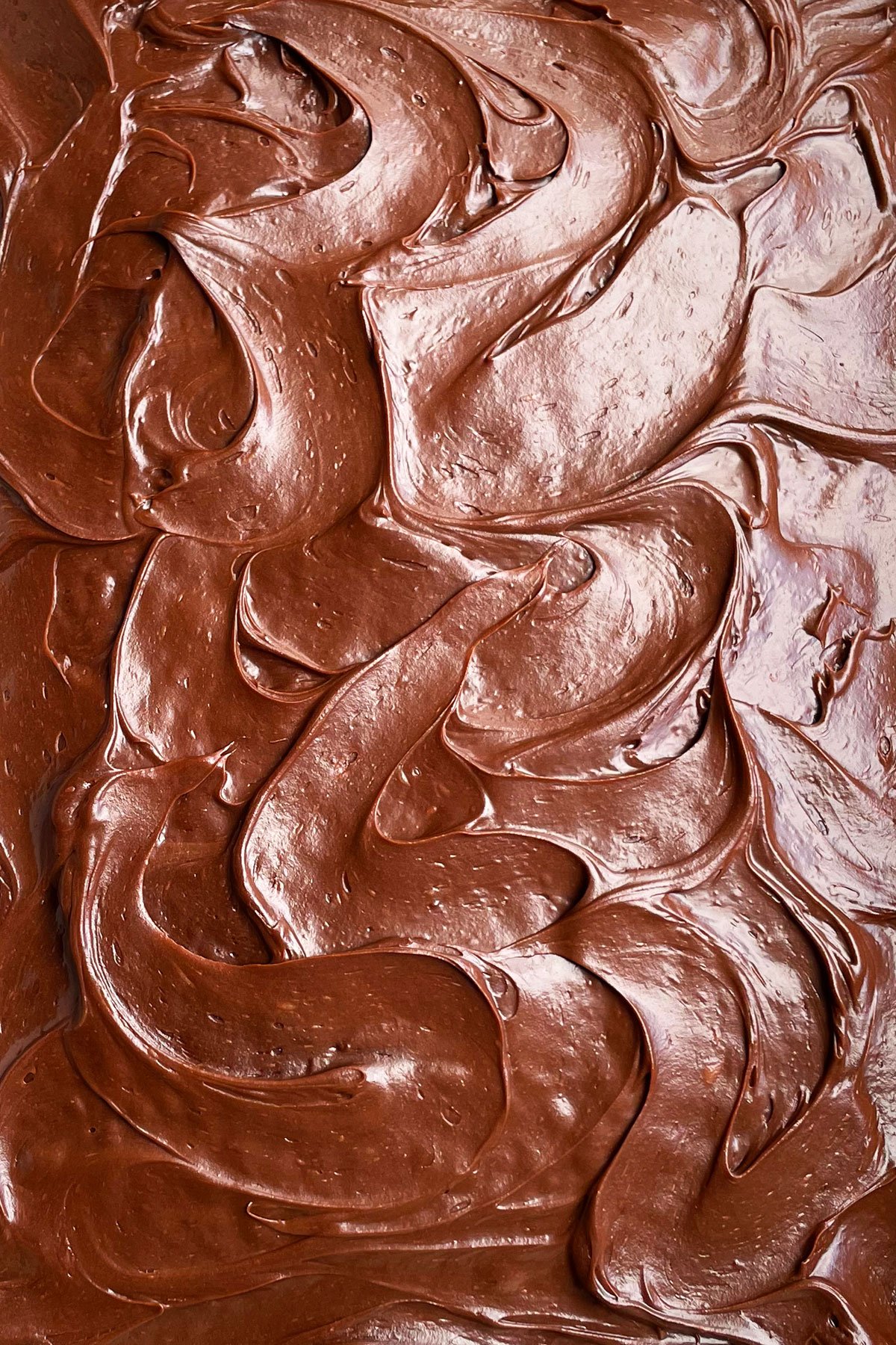 Closeup Shot of Cocoa Frosting Pattern Designed With a Spatula. 