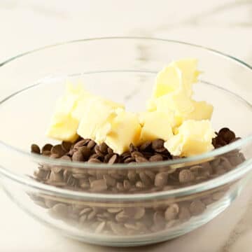 Butter and chocolate chips in glass bowl. 