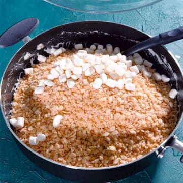 Rice krispies cereal and mini marshmallows added to nonstick pot. 