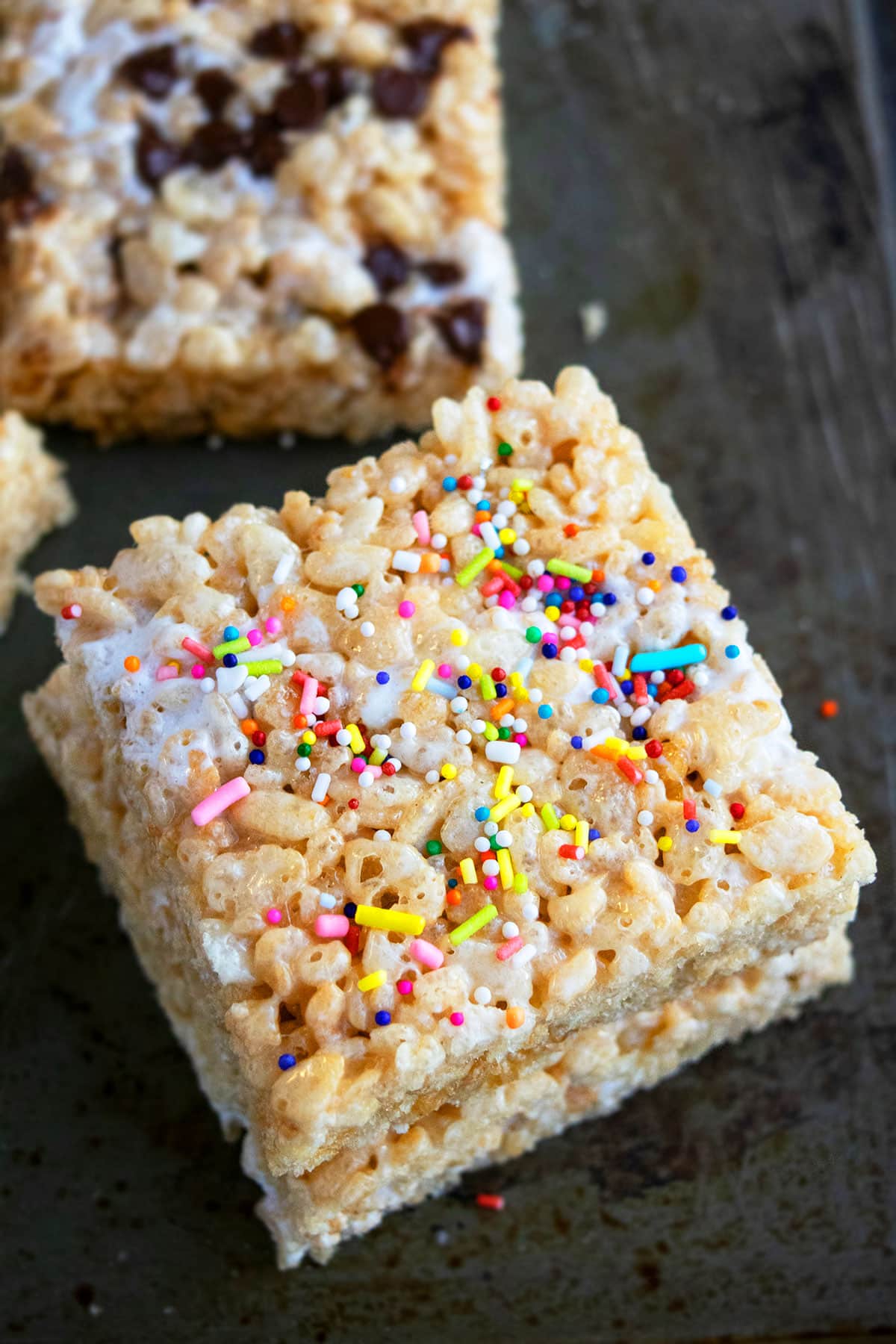 Best Marshmallow Rice Krispie Bars With Sprinkles on Gray Background.