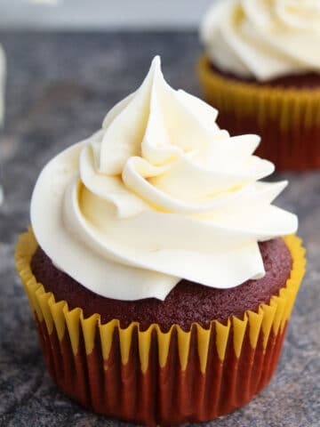 Easy Swiss Meringue Buttercream Frosting Piped on Top of Cupcake.