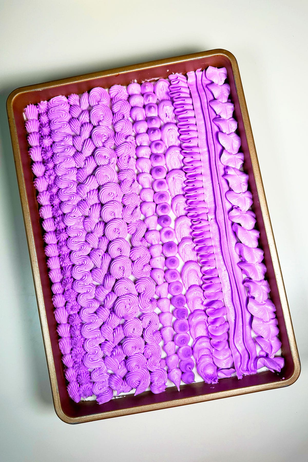 Sheet Cake on White Background With Purple Buttercream Piping Design.  