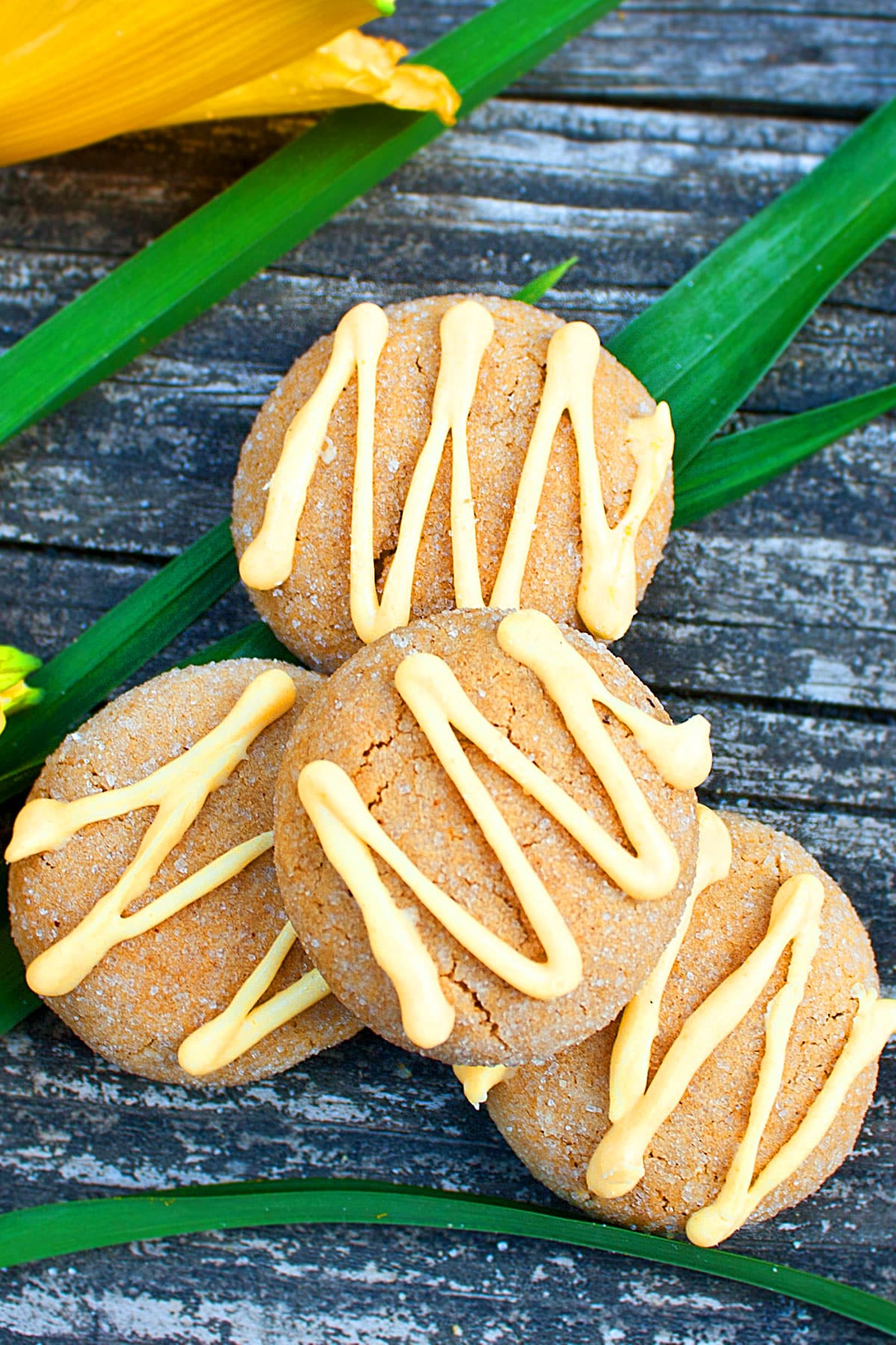 Spiced Swedish Cookies With Yellow Chocolate Drizzle on Rustic Wood Background.  