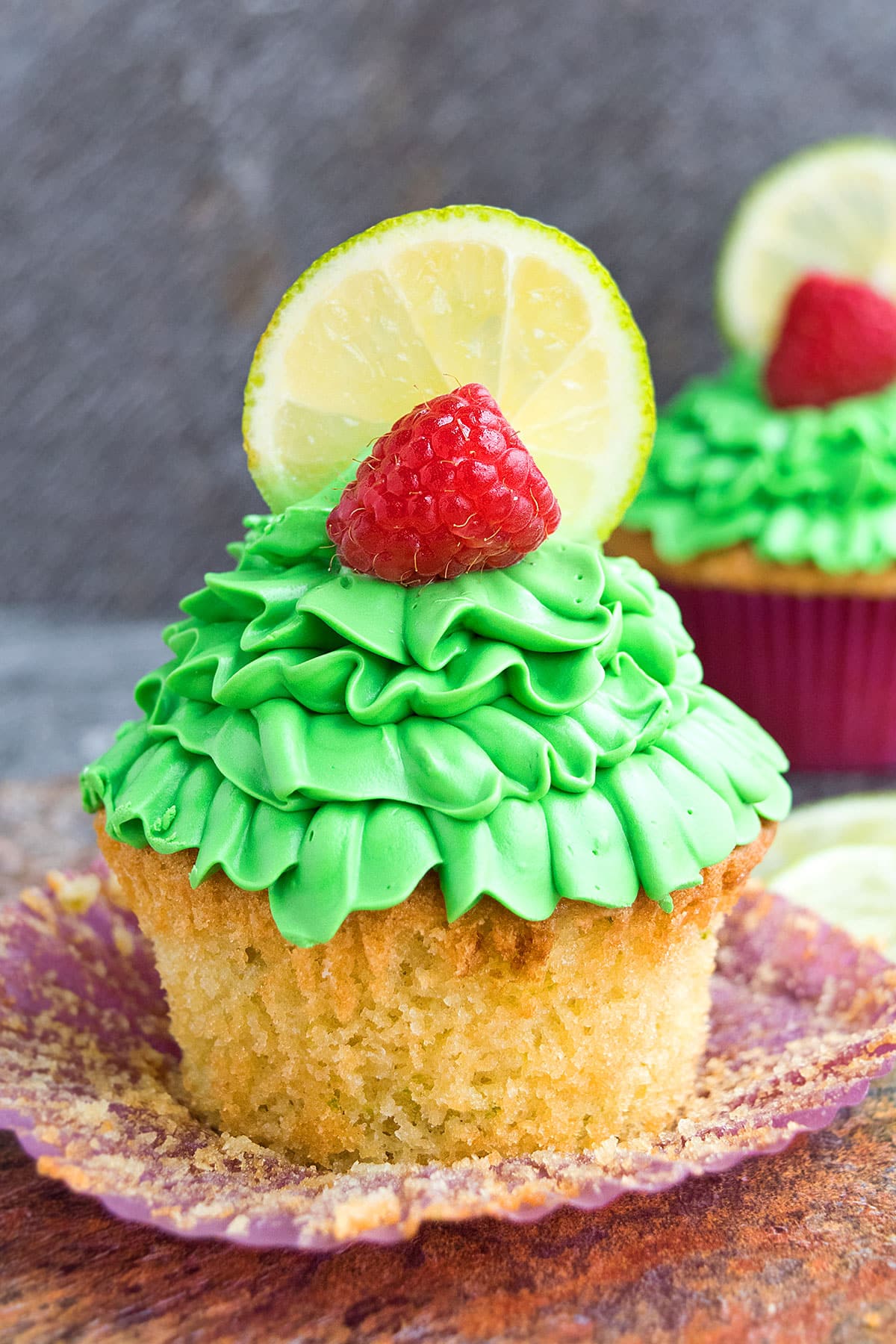 Summer Cupcakes With Raspberries and Lemon Zest With Liner Removed.