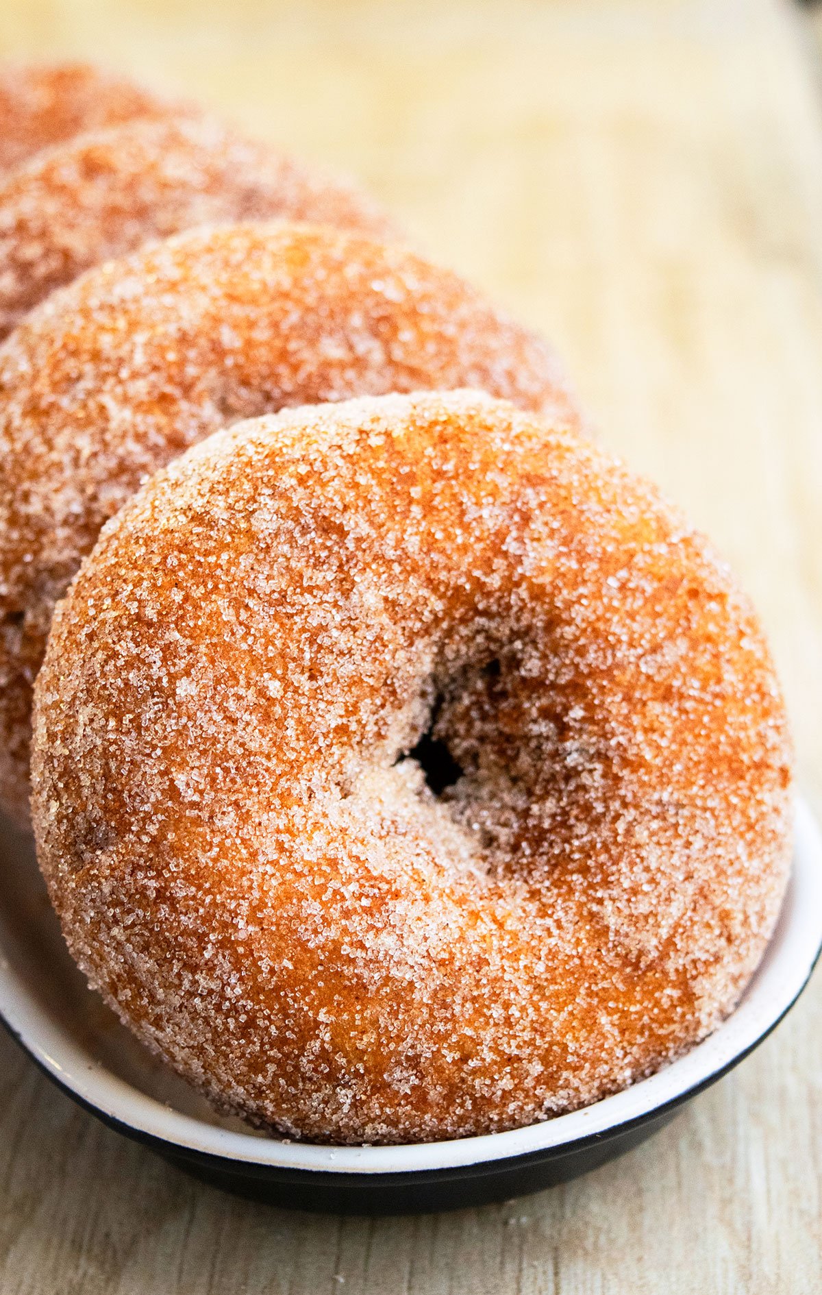 Easy Baked Apple Cider Donuts in Black and White Dish. 