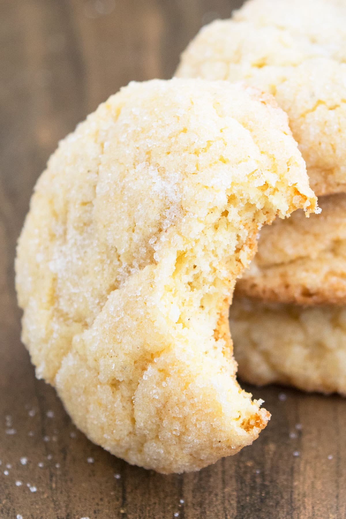 Partially Eaten Cookie on Wood Background. 